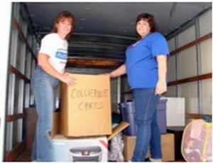 Volunteers loading truck with donations